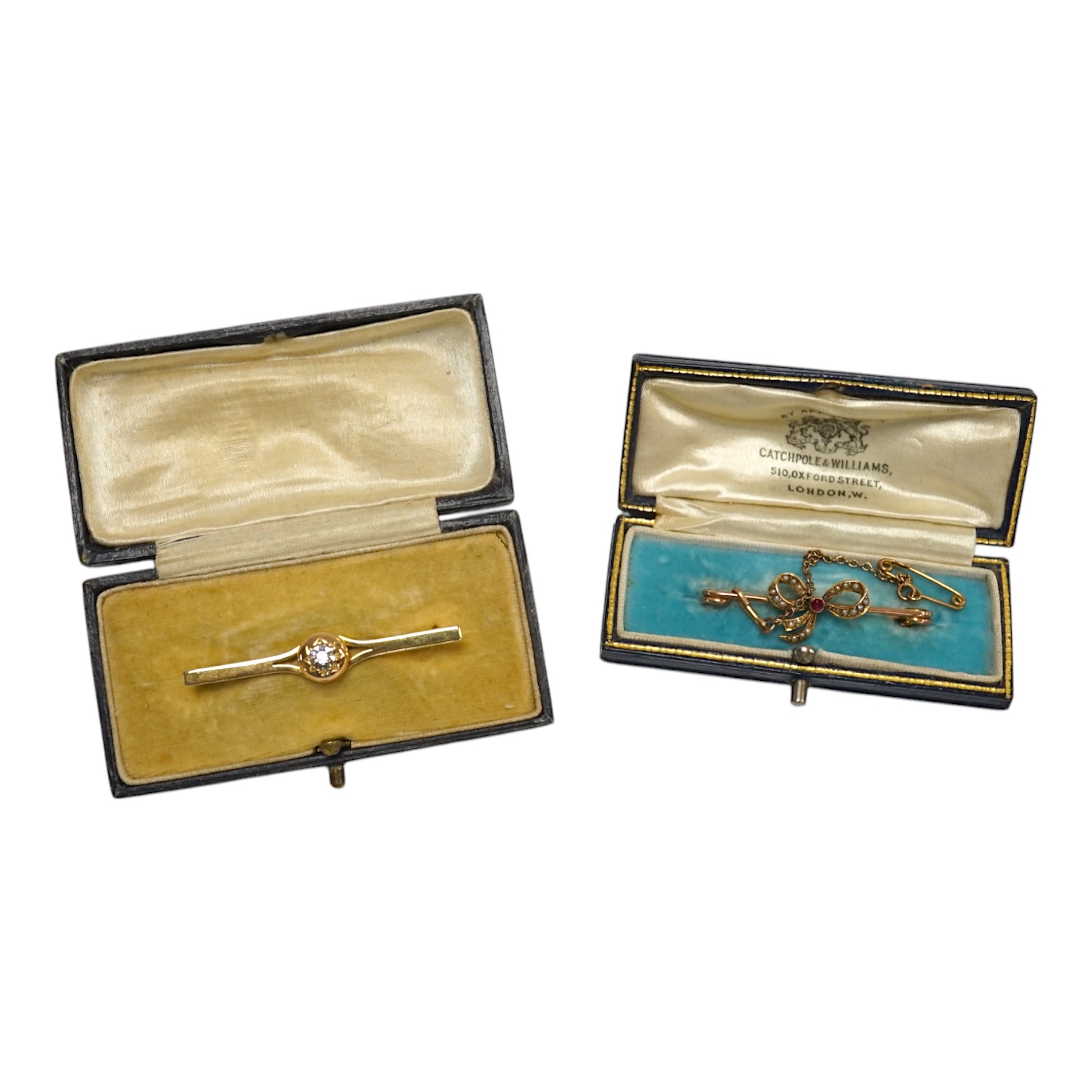 An early 20th century 15ct and solitaire diamond set bar brooch, 44mm, gross 3.5 grams and a similar 15ct, ruby and seed pearl set ribbon bow bar brooch, 2.4 grams. Condition - fair to good